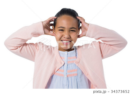 Girl standing against white background Girl standing against white background 34373652