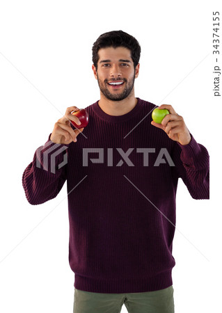 Portrait of smiling man holding apple 34374155