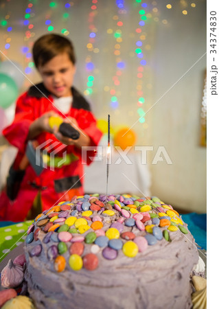 Cute boy pretending to be a fireman during birthday party Cute boy pretending to be a fireman during birthday party 34374830