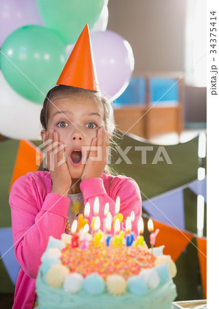 Birthday girl with cake at home Birthday girl with cake at home 34375414