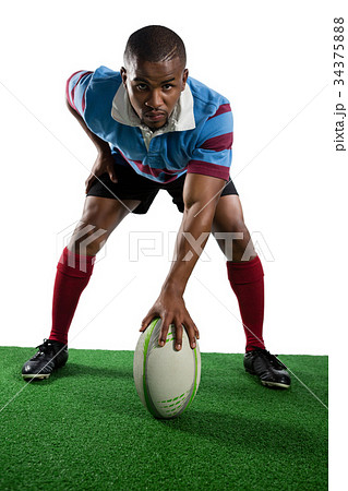 Full length of male player with rugby ball Full length of male player with rugby ball 34375888