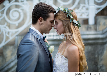 Wedding couple standing face to face Wedding couple standing face to face 34376130