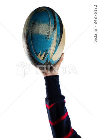 Cropped hand of female athlete holding rugby ball 34376132