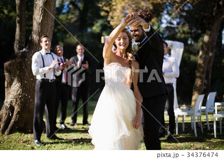 Affectionate couple dancing in park 34376474