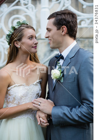 Wedding couple standing face to face 34376831