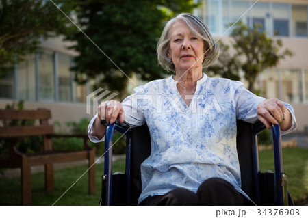Portrait of senior woman sitting on wheelchair 34376903