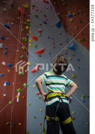 Thoughtful boy looking at wall in fitness studio 34377108