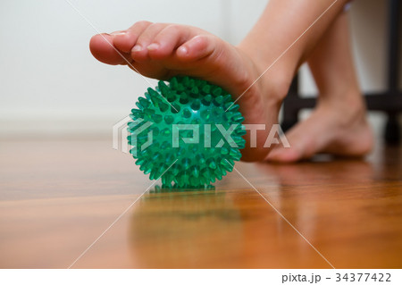 Girl exercising with stress ball in hospital 34377422