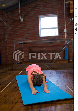 Teenage girl practicing yoga 34377459