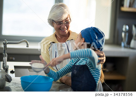 Grandmother praising granddaughter Grandmother praising granddaughter 34378556