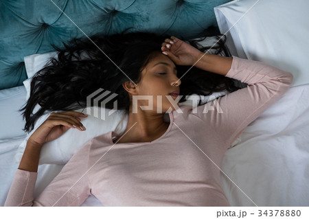 Woman sleeping on bed Woman sleeping on bed 34378880