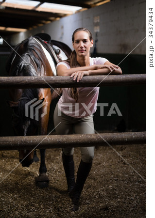 Full length portrait of female jockey Full length portrait of female jockey 34379434