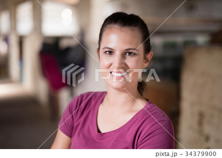 Close up portrait of smiling female jockey 34379900