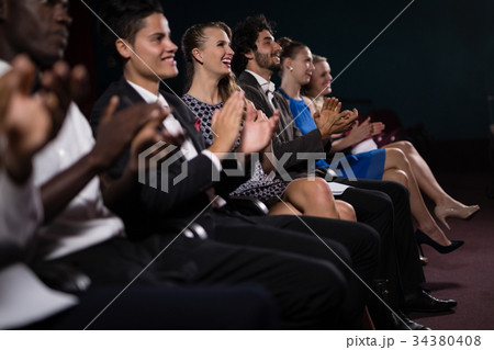 Group of people applauding Group of people applauding 34380408