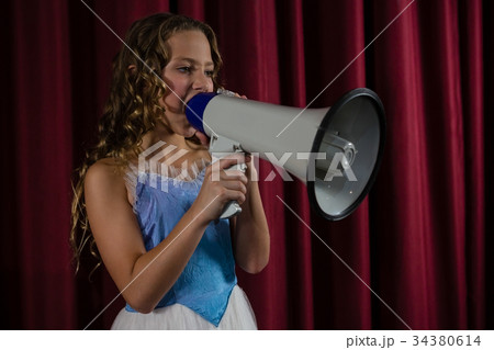 Female artist announcing on megaphone 34380614