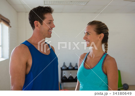 Smiling athletes talking in gym 34380649