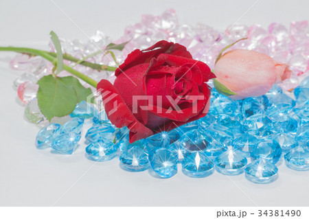 rose flowers are on the blue gemstones. rose flowers are on the blue gemstones. 34381490