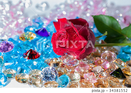 red rose flower on the colorful gemstones red rose flower on the colorful gemstones 34381552