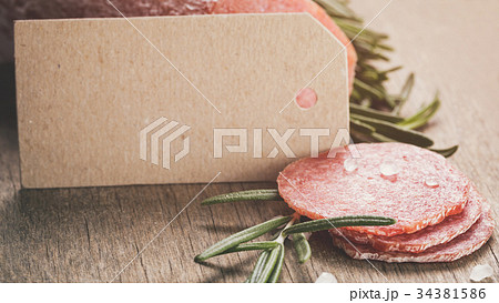 italian salami sausage slices with rosemary and italian salami sausage slices with rosemary and 34381586
