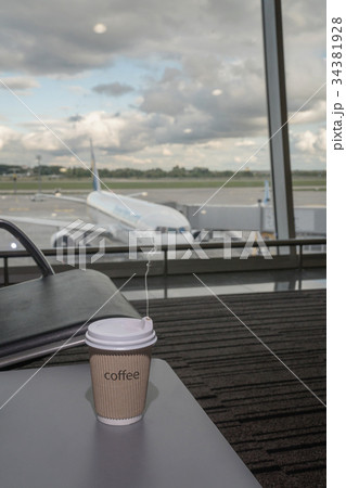 Cup of coffee in airport's business lounge Cup of coffee in airport's business lounge 34381928