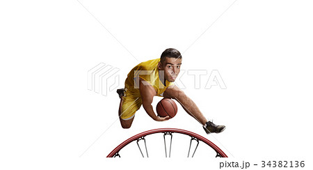 Basketball player make slum dunk on a white background Basketball player make slum dunk on a white background 34382136
