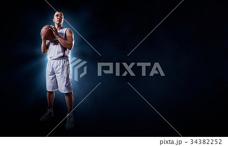 Basketball players on a black background 34382252