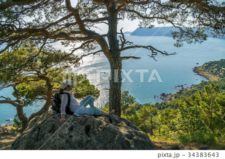 Woman Tourist sitting in Crimean Mountains near 34383643