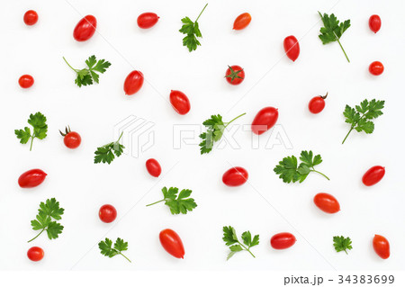 Pattern of red mini tomatoes, parsley on white 34383699