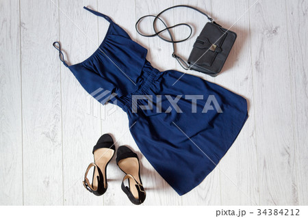 Blue sundress, a black handbag and shoes 34384212