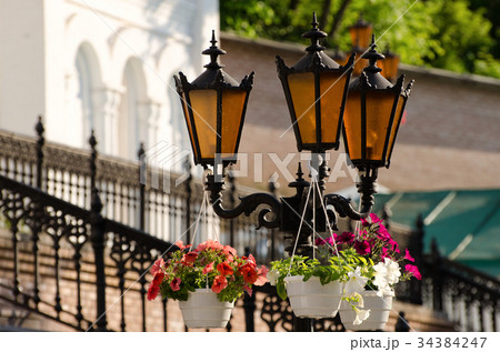 Three orange street lamps against 34384247
