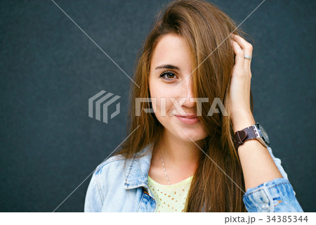 The girl of a floor of the face is closed by hair The girl of a floor of the face is closed by hair 34385344