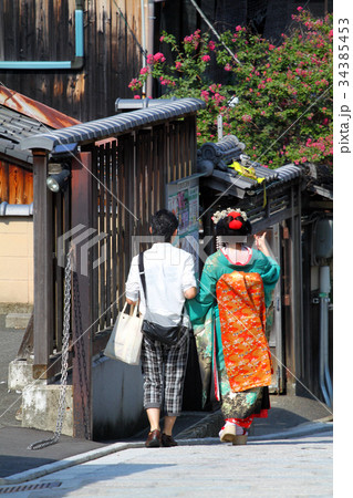 Maiko walking on a street (Kyoto, Japan) .. Maiko walking on a street (Kyoto, Japan) .. 34385453