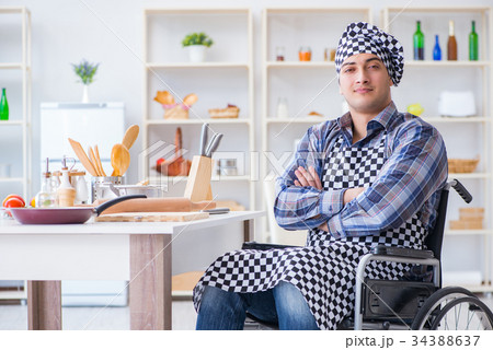Disabled young husband frying at kitchen 34388637