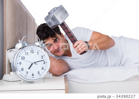 Man in bed suffering from insomnia Man in bed suffering from insomnia 34390227