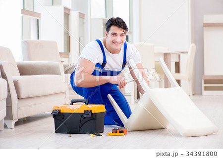Furniture repairman working in store Furniture repairman working in store 34391800