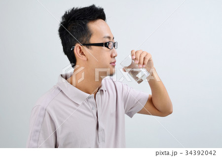 Asian man drinking mineral water 34392042
