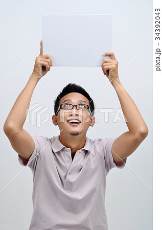 Asian man holding blank card 34392043