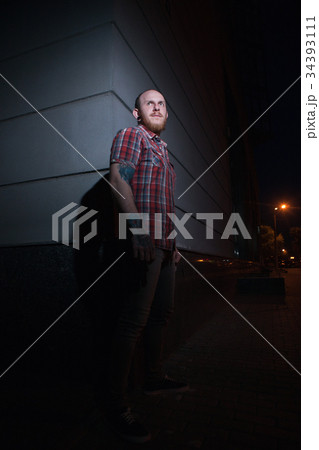 Stylish hipster male model at night 34393111