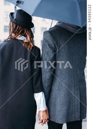 Love couple in rainy day. Fashion style 34393112