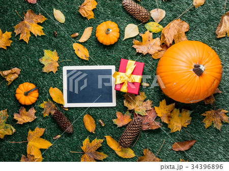 menu blackboard with pumpkin and gift  34396896