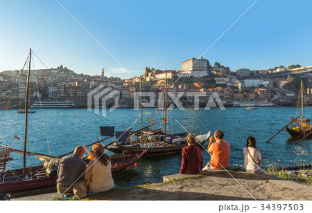 Tourist sitting douro river Porto ,Portugal 34397503