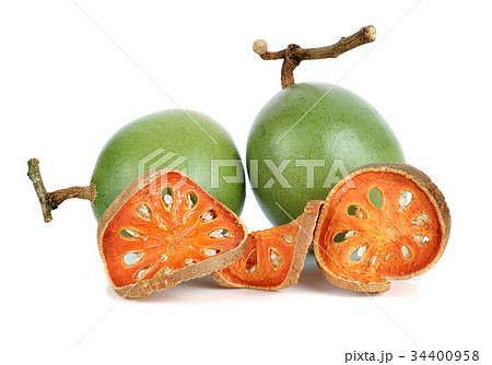 Aegle marmelos and Dry bael fruit on white 34400958