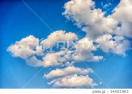 white clouds in a blue sky in a daytime 34401963