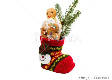 Biscuits in a christmas sock isolated 34403901