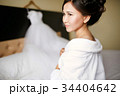 A bride in a white robe from the morning before 34404642