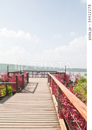 Wooden walkway in the garden on the mountain Wooden walkway in the garden on the mountain 34412278