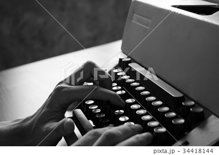 Male hands typing on the old typewriter Male hands typing on the old typewriter 34418144