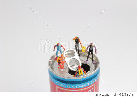 small diver stands on an open aluminum can small diver stands on an open aluminum can 34418375