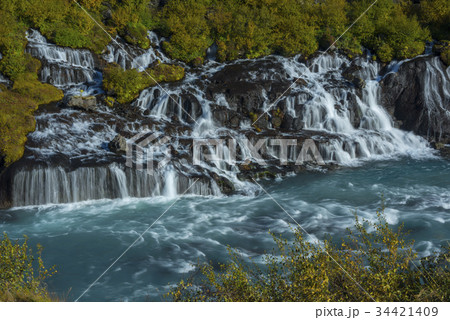 Waterfall among autumn foliage Waterfall among autumn foliage 34421409
