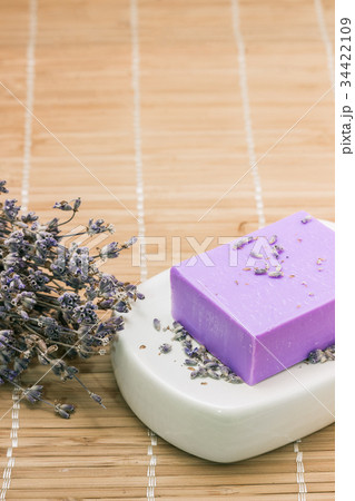 Bar of natural lavandah soap on white soap dish Bar of natural lavandah soap on white soap dish 34422109